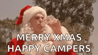 a man dressed as santa claus is drinking from a bottle and saying merry xmas happy campers .
