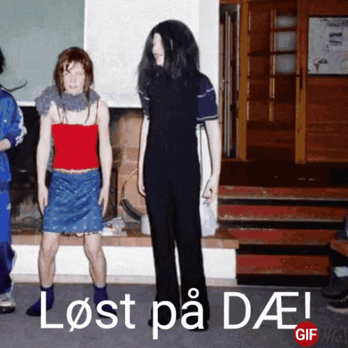 a group of people are standing in front of a sign that says lost på daei gif