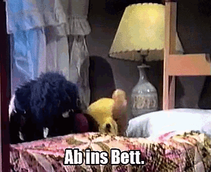 a bed with a lamp and the words ab ins bett written on it