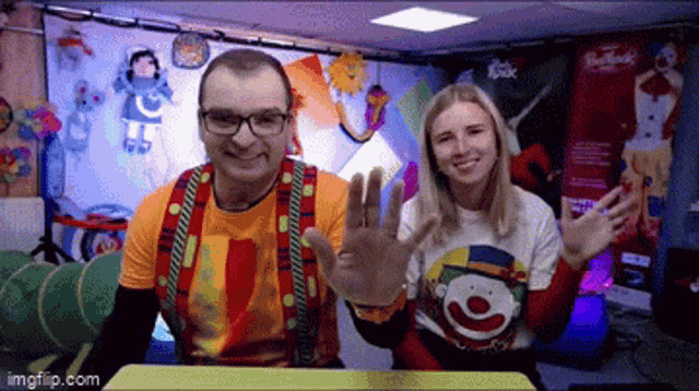 a man and a woman wearing clown shirts waving