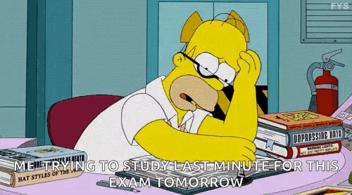 homer simpson is sitting at a desk with a stack of books on it