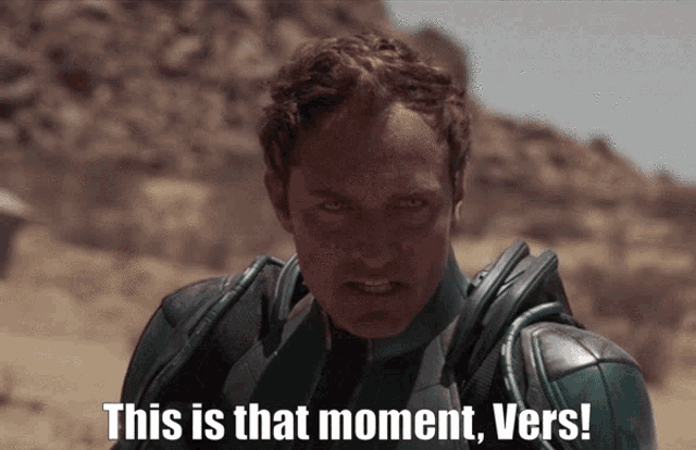 a man in a green suit with the words this is that moment vers
