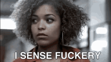 a woman with curly hair is saying i sense fuckery .