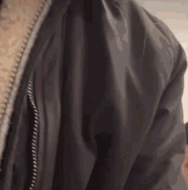 a close up of a person wearing a jacket