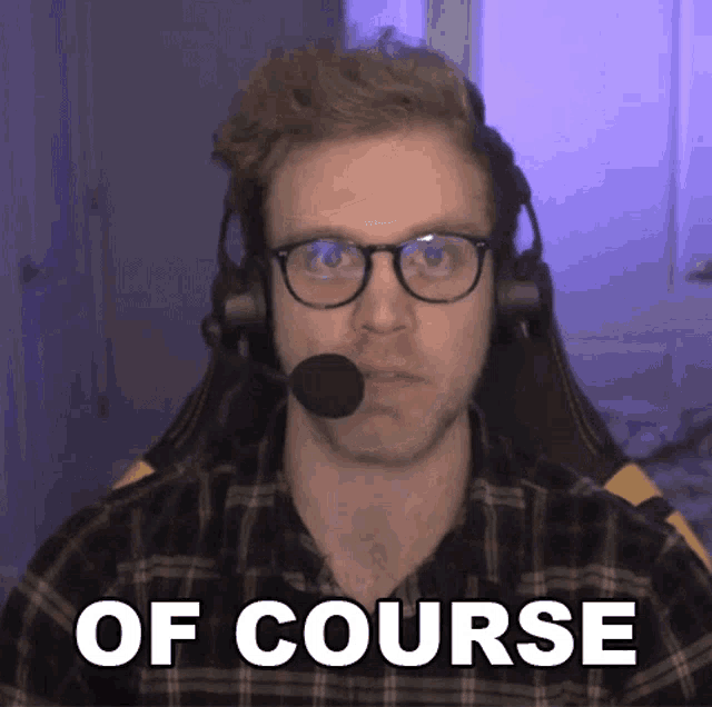 a man wearing glasses and a headset with the words of course above him
