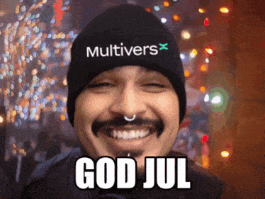 a man wearing a beanie that says multivers x on it