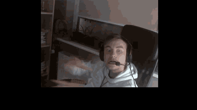 a man wearing headphones with a microphone on his head
