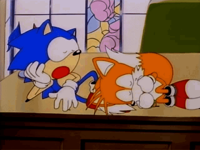 a cartoon of sonic the hedgehog and tails the fox sitting at a table