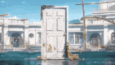 a white door is standing in the middle of a flooded building .