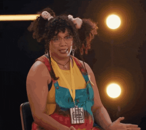 a woman wearing a lanyard that says " culture " on it