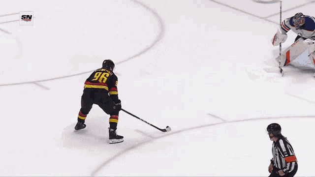 a hockey player wearing a jersey with the number 96 on it