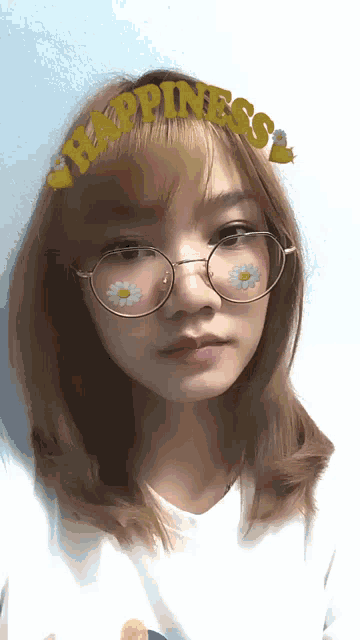 a girl wearing glasses and a headband that says " happiness "