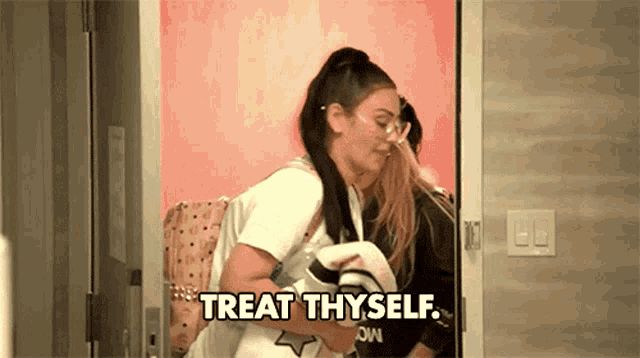 a woman is standing in a doorway with the words `` treat thyself '' written on the bottom .