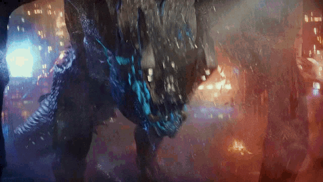 a giant monster is coming out of the water in a city at night