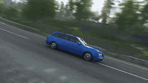 a blue car is driving down a road with a license plate that says ' aa ' on it