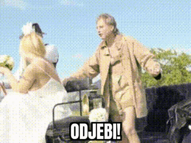 a man in a trench coat is standing next to a naked woman in a wedding dress in a horse drawn carriage .