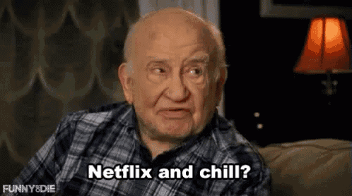 an elderly man in a plaid shirt is sitting on a couch and talking about netflix and chill .