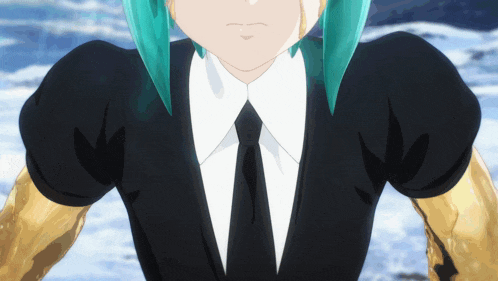 a close up of a person wearing a black suit