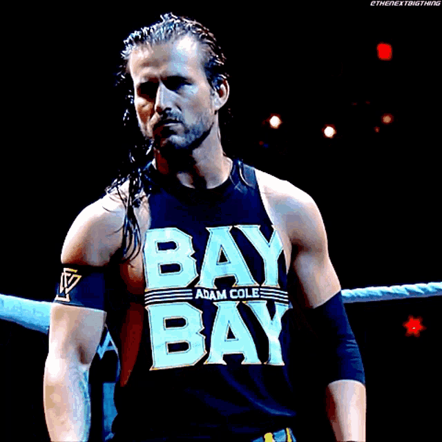 a wrestler wearing a black bay bay shirt