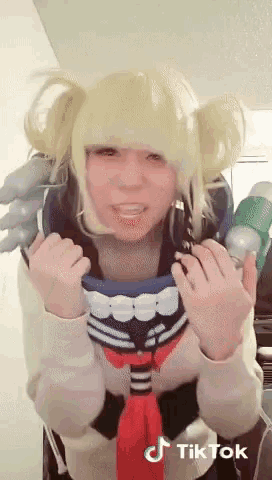 a woman in a cosplay costume has a tik tok sticker on her face