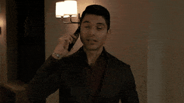 a woman in a white jacket is talking on her phone