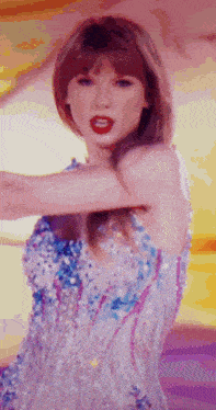 a woman in a sequined dress with red lipstick is dancing .
