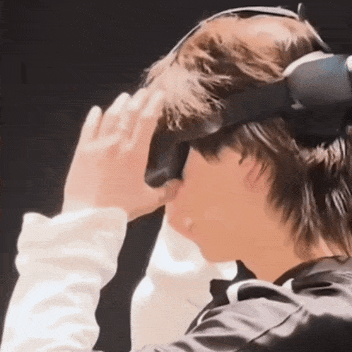 a man wearing a virtual reality headset is looking at something