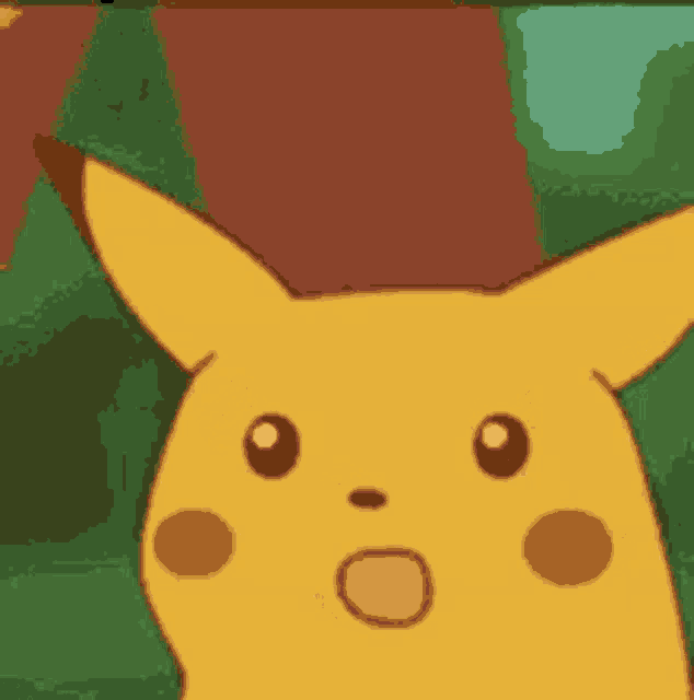 a close up of a pikachu with a surprised look on his face .