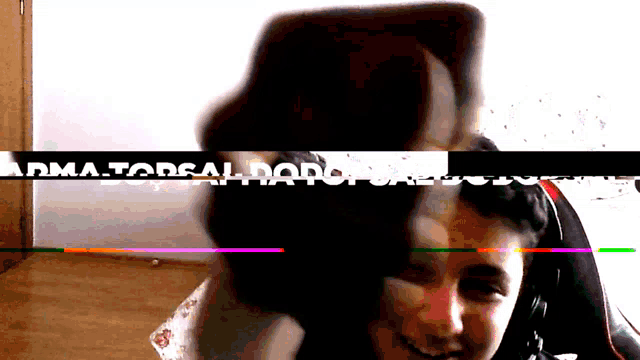 a blurred image of a person with the words arma.torsal.dado written in white