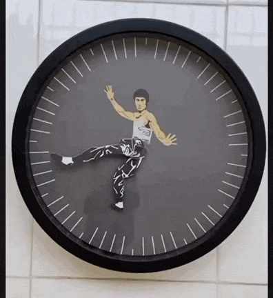 a clock with a picture of bruce lee in the center