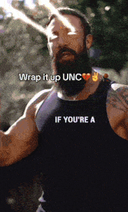 a man with a beard is wearing a black tank top that says if you 're a