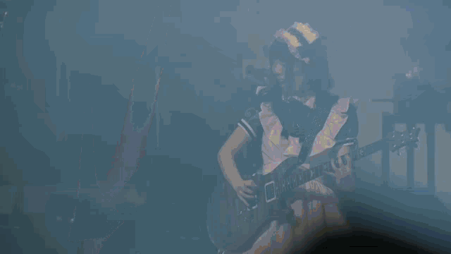 a woman in a maid outfit plays a guitar