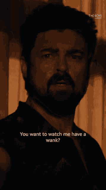 a man with a beard is asking if he wants to watch me have a wank
