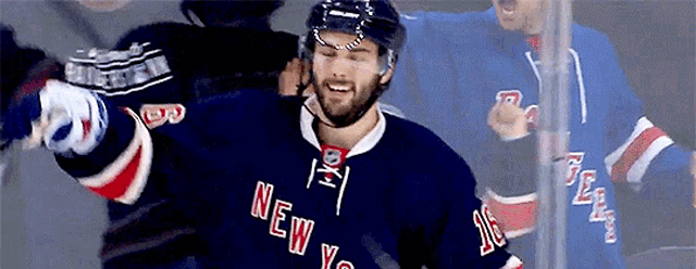 a hockey player for the new york rangers is celebrating