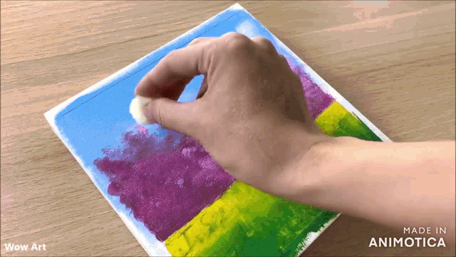 a person is painting a picture with the words wow art behind them