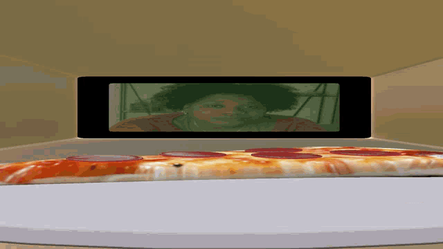 a picture of a woman and a pepperoni pizza in a microwave