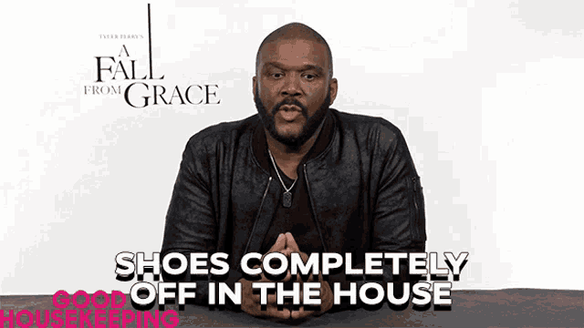 a man in a black leather jacket is talking about shoes completely off in the house