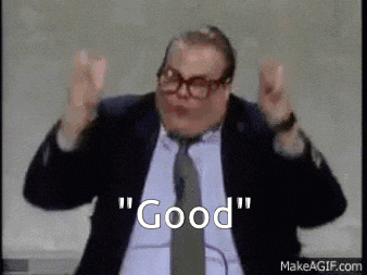 a man in a suit and tie is standing in front of a white board and says `` good '' .