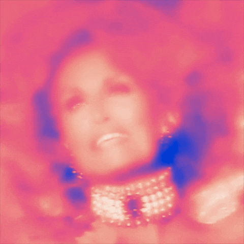 a blurry picture of a woman 's face with her mouth open .