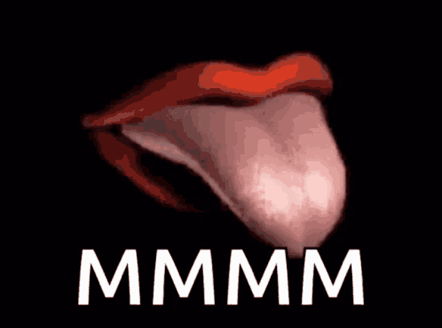 a close up of a woman 's mouth with her tongue sticking out and the word mmmm written below it .