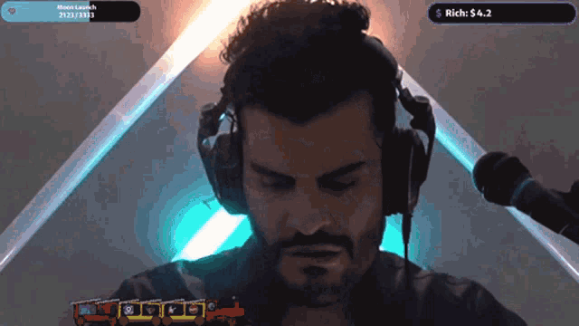 a man wearing headphones is playing a video game with a purple screen that says rich : $ 4.2