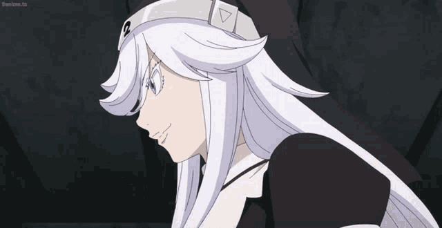 a girl with white hair is wearing a black and white outfit and a hat with the letter q on it