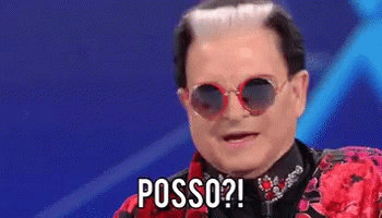 a man wearing sunglasses and a red jacket has the word posso written on his face .