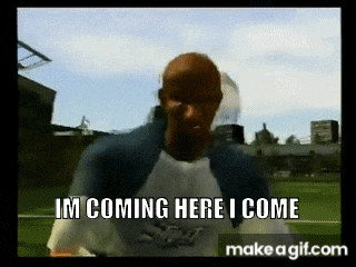 a man in a baseball uniform is standing on a field and says i 'm coming here i come