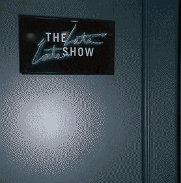 a sign that says the late show is on a door