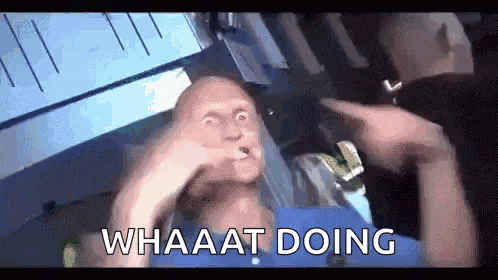 a man is making a funny face while sitting in an ambulance with the words whaaat doing .