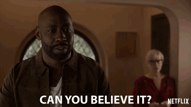 a man says " can you believe it " with a woman behind him