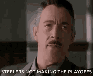 a man in a suit and tie is making a funny face and saying steelers not making the playoffs .
