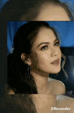 a close up of a woman 's face with the words xrecorder below