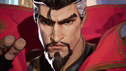 a close up of a man with a beard wearing a red cloak